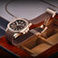 Luxury watch with brown leather strap on a wooden display box