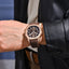 Man wearing a watch PD-YS031 with brown strap.