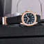 Luxury watch PD-YS031 with black strap and rose gold case on a textured surface