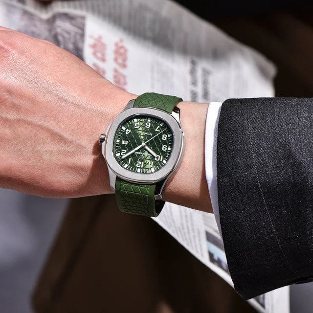 Hand wearing a green PD-YS031 watch with a blurred newspaper background